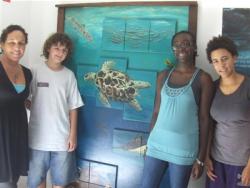From left., teacher Gloria Zakers, Adam Berry, Kai Bartlette and Simi Pearl-Edwards are studying turtles for their trip. From left., teacher Gloria Zakers, Adam Berry, Kai Bartlette and Simi Pearl-Edwards are studying turtles for their trip.